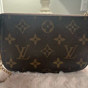 Authentic Louis Vuitton Mini pochette bag